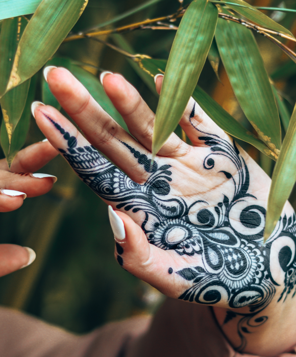 The under side of a hand covered in henna