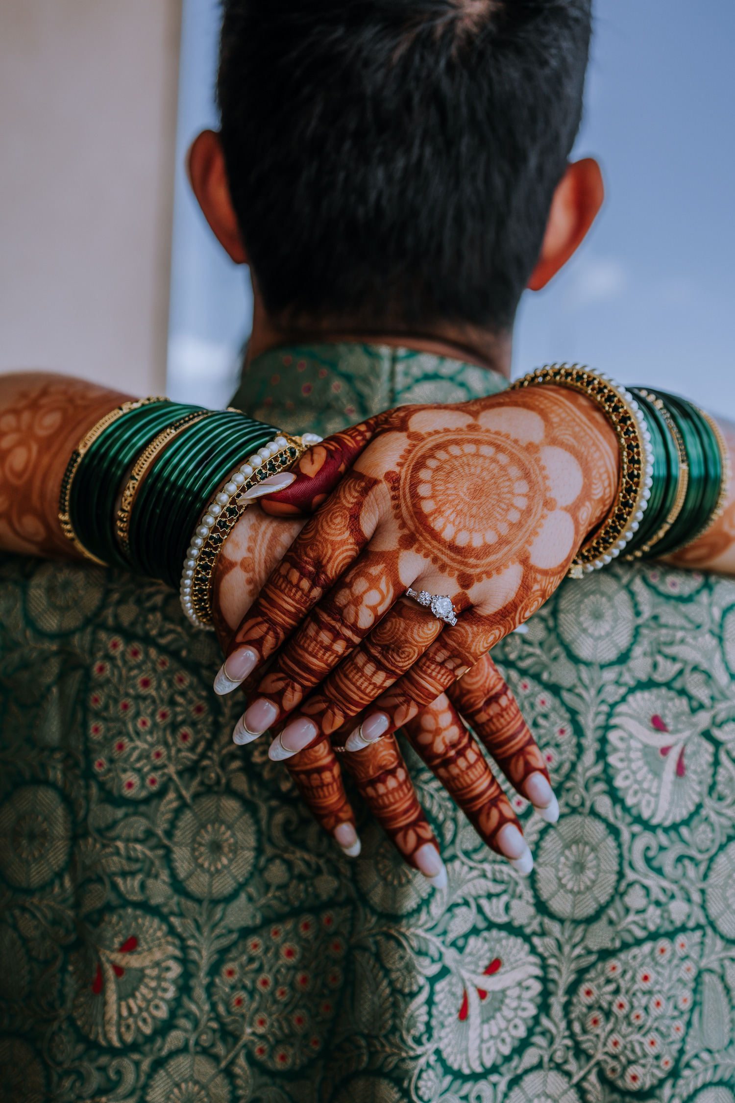 A closeup shot of henna on the bride's hands.